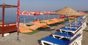 Nesting zone occupied by beach furniture and carpets in Fethiye, Turkey.
